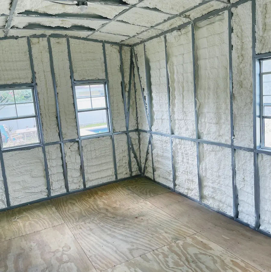 Closed-cell spray foam insulation applied to wall cavities in a residential project in Plantation